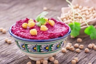 Beetroot hummus is a delicious and healthy dip made from cooked beets, chickpeas, tahini, olive oil, garlic, lemon, and spices.